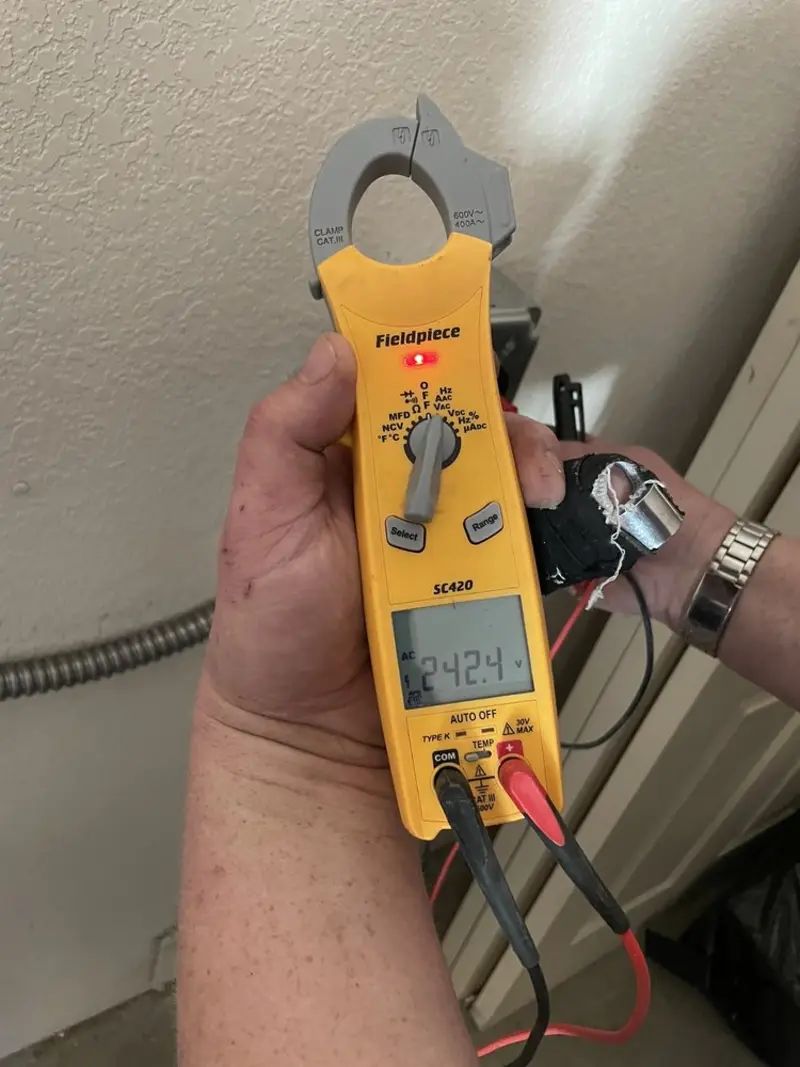 Voltage testing with clamp meter during Recessed Lighting Installation in Lower Milford
